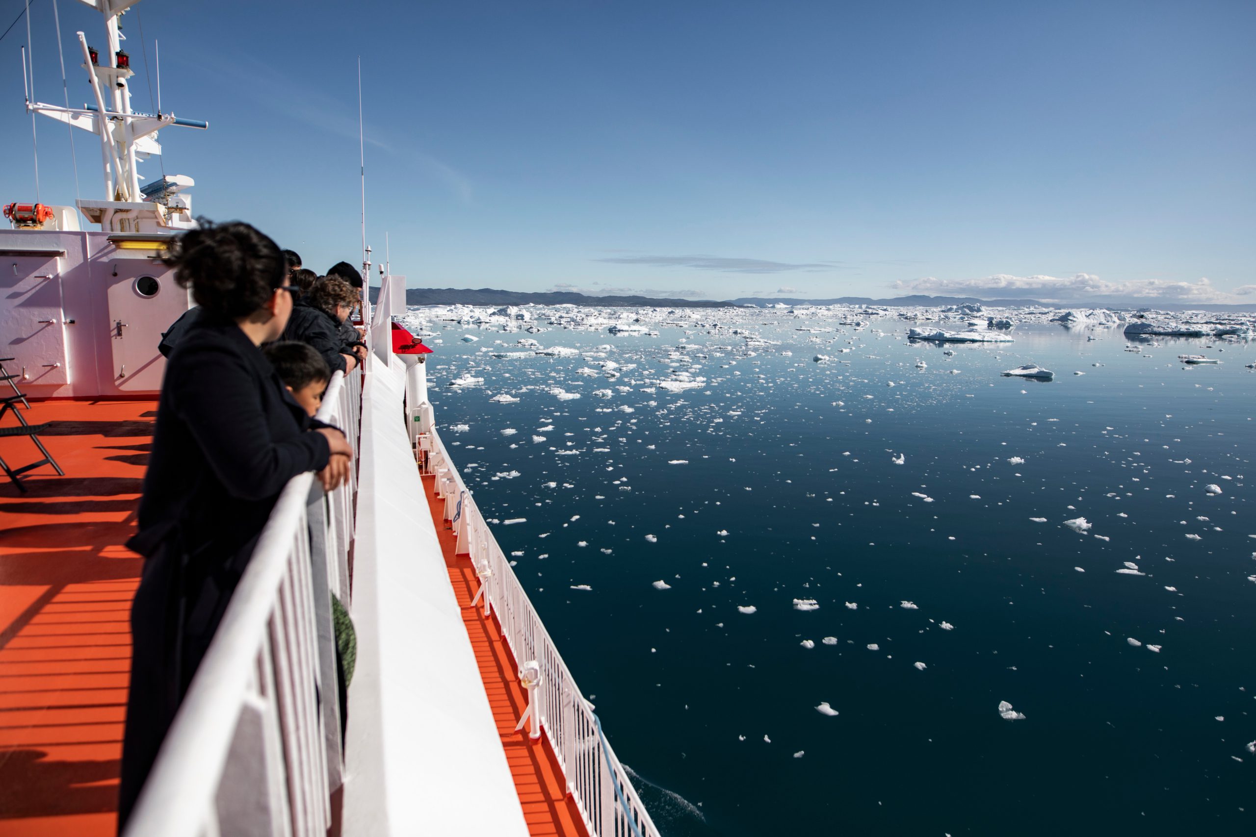 Ferry passengers standing on the deck to look at the Ilulissat icefjord